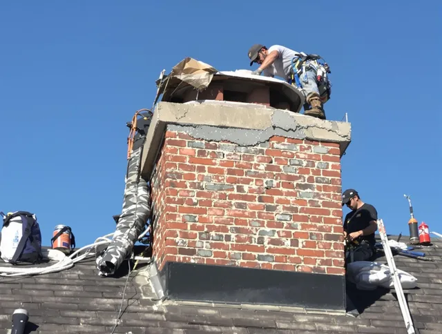 Fort Mill Chimney Sweep installing a custom chimney crown in Fort Mill, SC