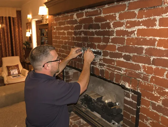 Fort Mill Chimney Sweep expert fixing a fireplace in Fort Mill, SC